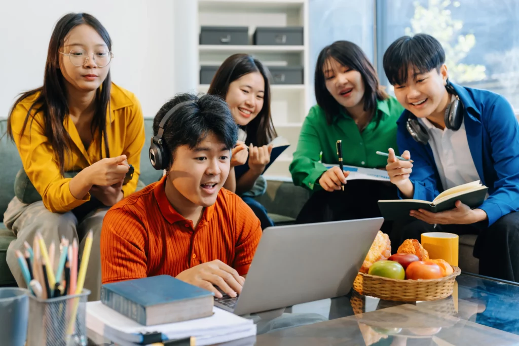 Asian college student reading a book study