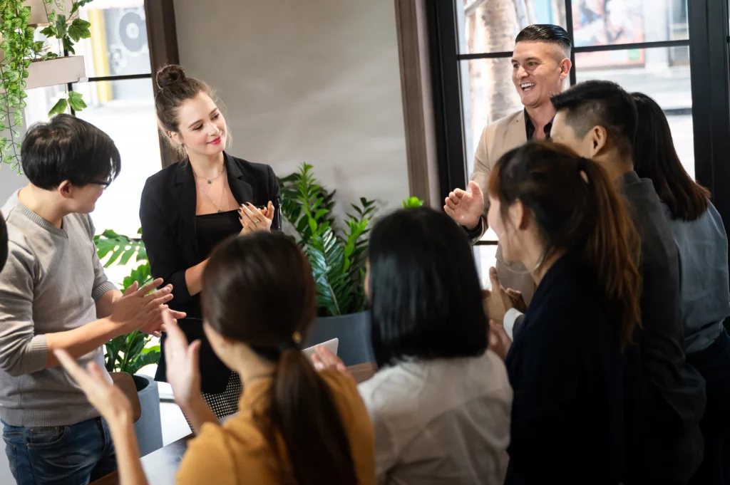 Group of business employees discussing work in a meeting